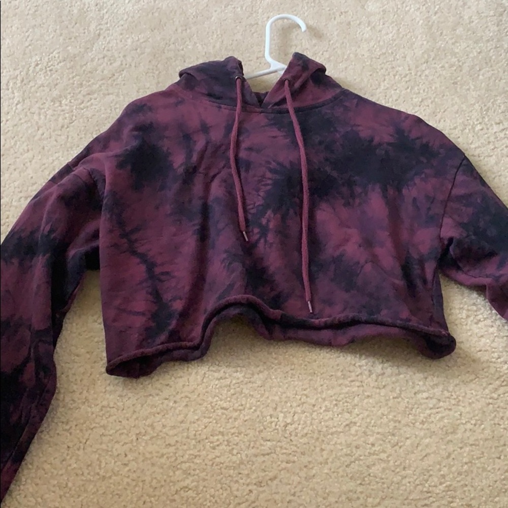 purple and black tie-dyed cropped hoodie